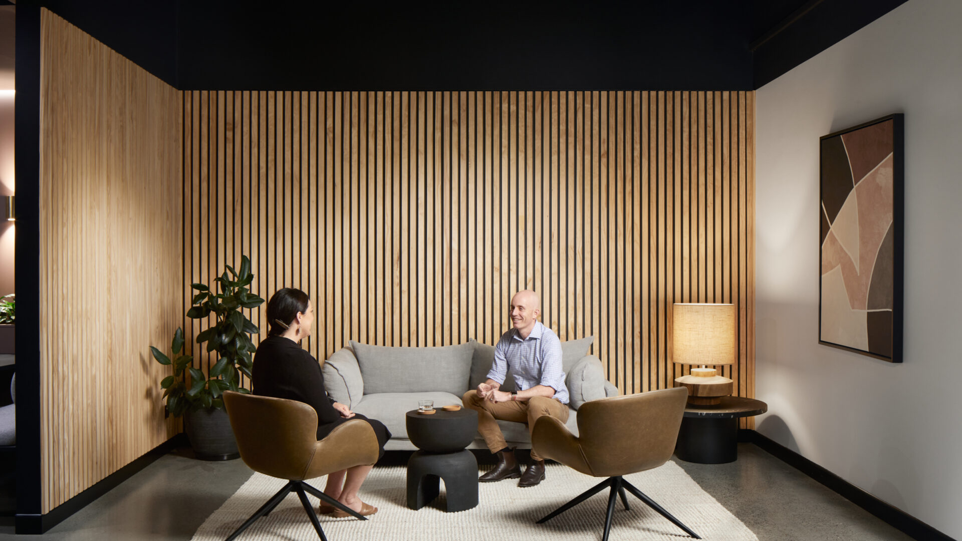 Inside the LaneCampos office in Newcastle, NSW — timber-slat lounge where Dave Lane and his team meet clients